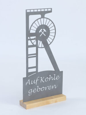 Stahl-Schild AUF KOHLE GEBOREN auf Holz