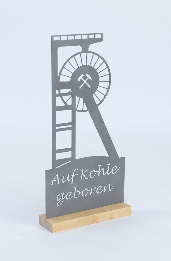 Stahl-Schild AUF KOHLE GEBOREN auf Holz
